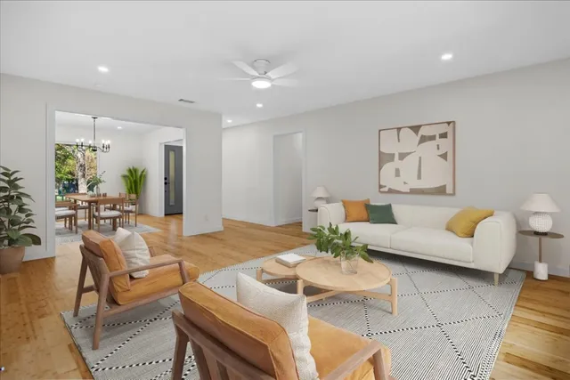 a living room with furniture and a table