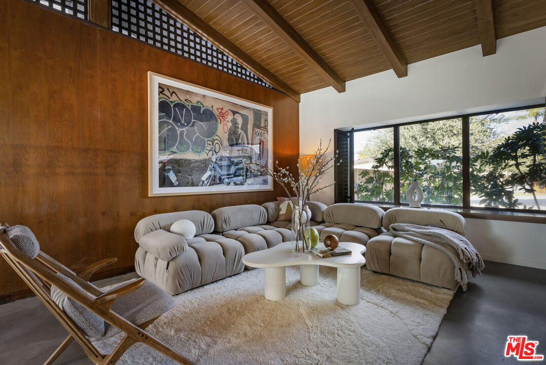 9440 Gallatin Road Downey, CA 90240 - Photo 11 of 55 a living room with furniture and a large window