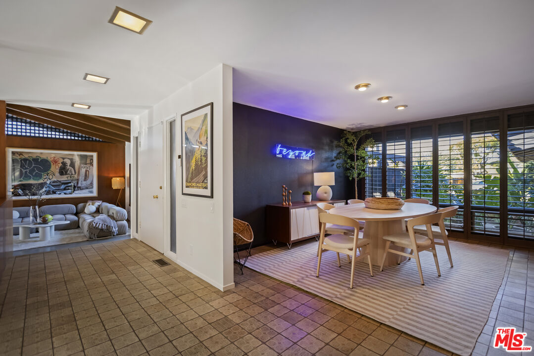 9440 Gallatin Road Downey, CA 90240 - Photo 17 of 55 a view of a dining room with furniture window and outside view