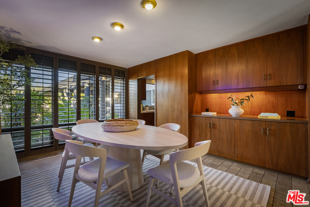9440 Gallatin Road Downey, CA 90240 - Photo 18 of 55 a view of a dining room with furniture window and wooden floor
