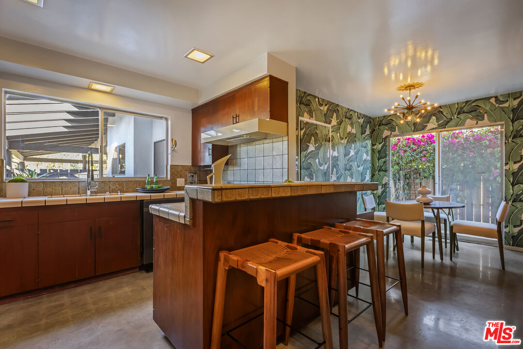 9440 Gallatin Road Downey, CA 90240 - Photo 21 of 55 a view of a dining room with furniture window and outside view