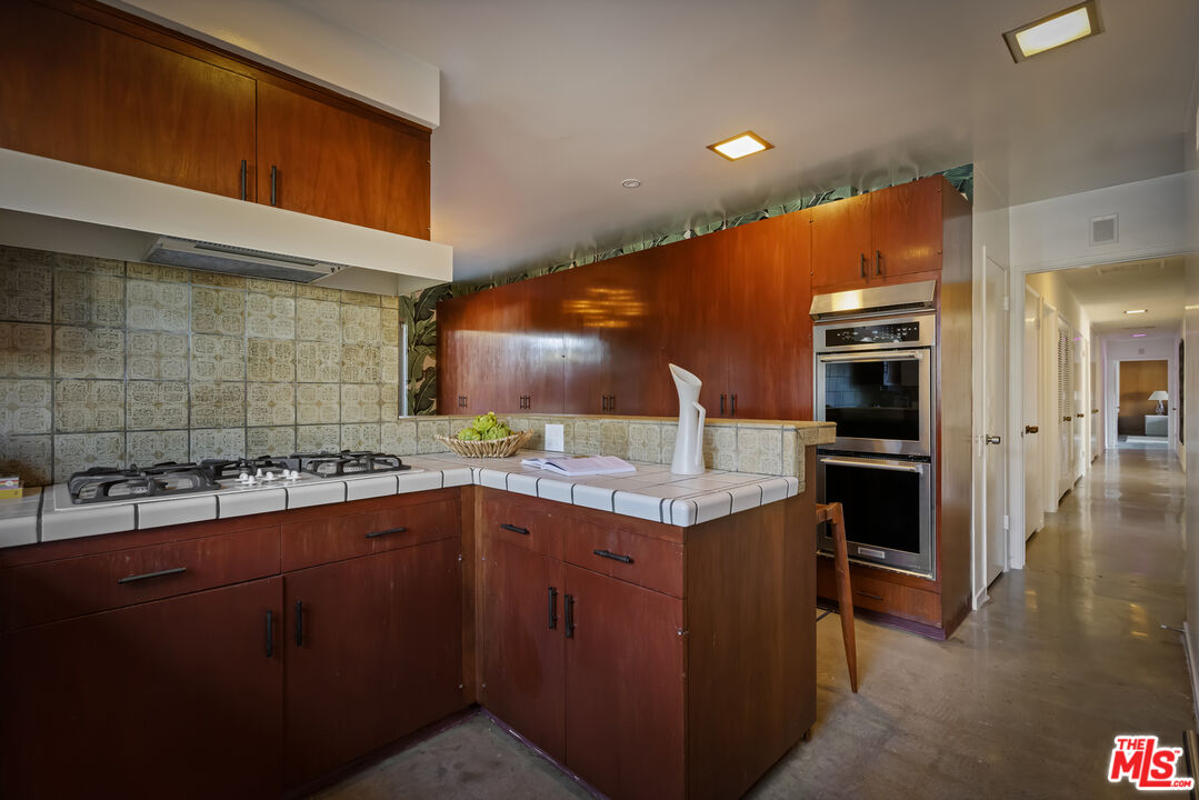 9440 Gallatin Road Downey, CA 90240 - Photo 23 of 55 a kitchen with a sink and cabinets