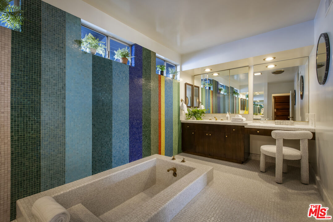 9440 Gallatin Road Downey, CA 90240 - Photo 27 of 55 a bathroom with a sink a large mirror and a shower