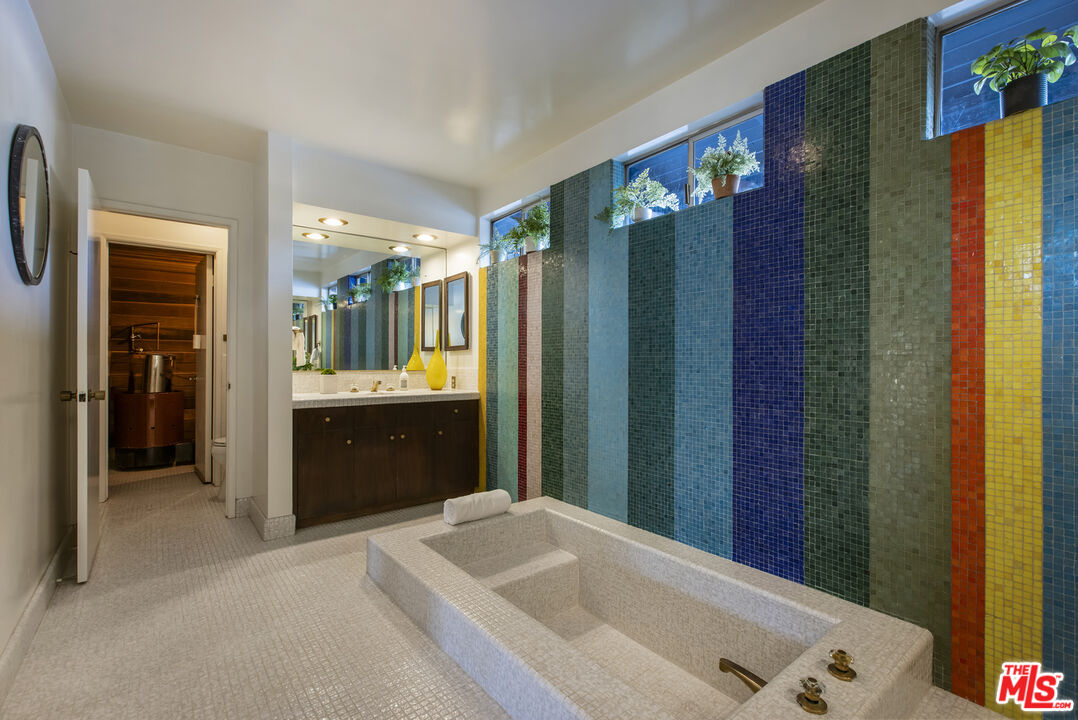 9440 Gallatin Road Downey, CA 90240 - Photo 28 of 55 a bathroom with a tub sink vanity granite and a shower