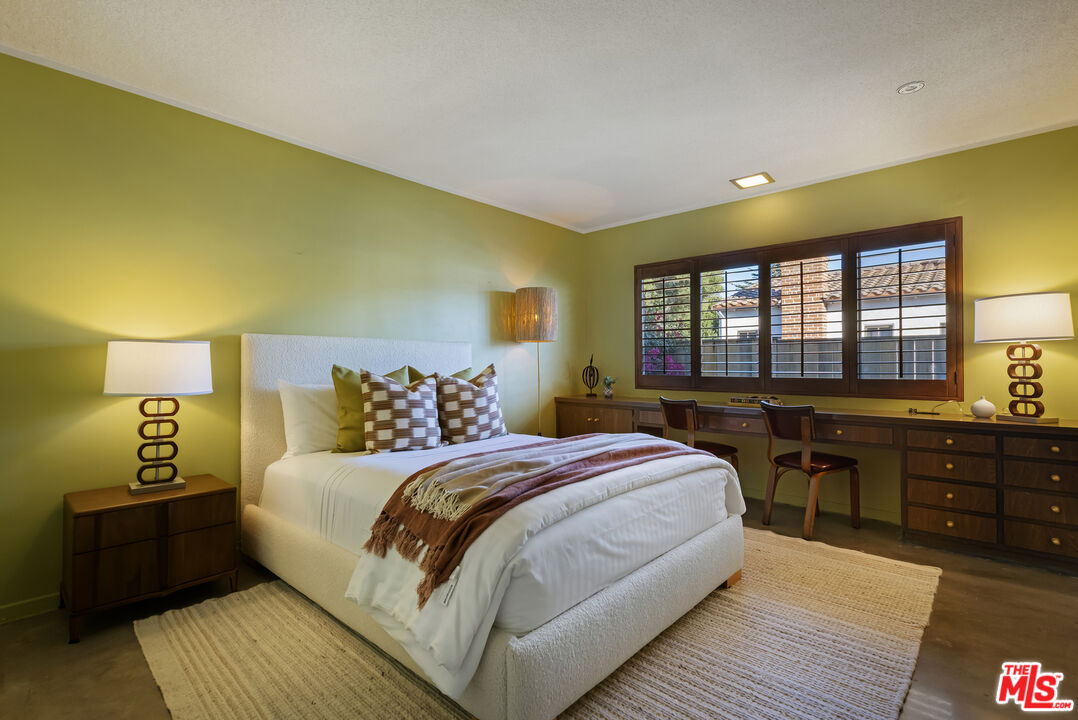 9440 Gallatin Road Downey, CA 90240 - Photo 31 of 55 a bedroom with a bed and wooden floor