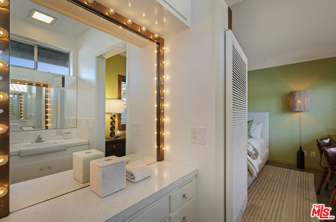 9440 Gallatin Road Downey, CA 90240 - Photo 33 of 55 a spacious bathroom with a double vanity sink a mirror and a shower