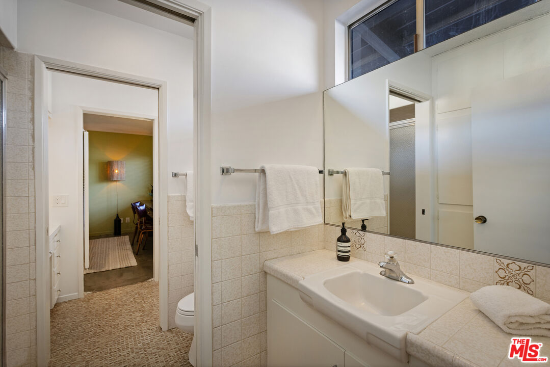9440 Gallatin Road Downey, CA 90240 - Photo 34 of 55 a bathroom with a sink and a mirror