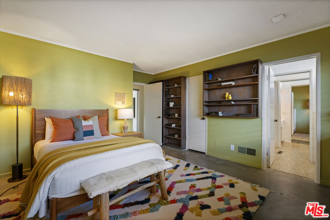 9440 Gallatin Road Downey, CA 90240 - Photo 35 of 55 a bedroom with a bed and a bookshelf in it