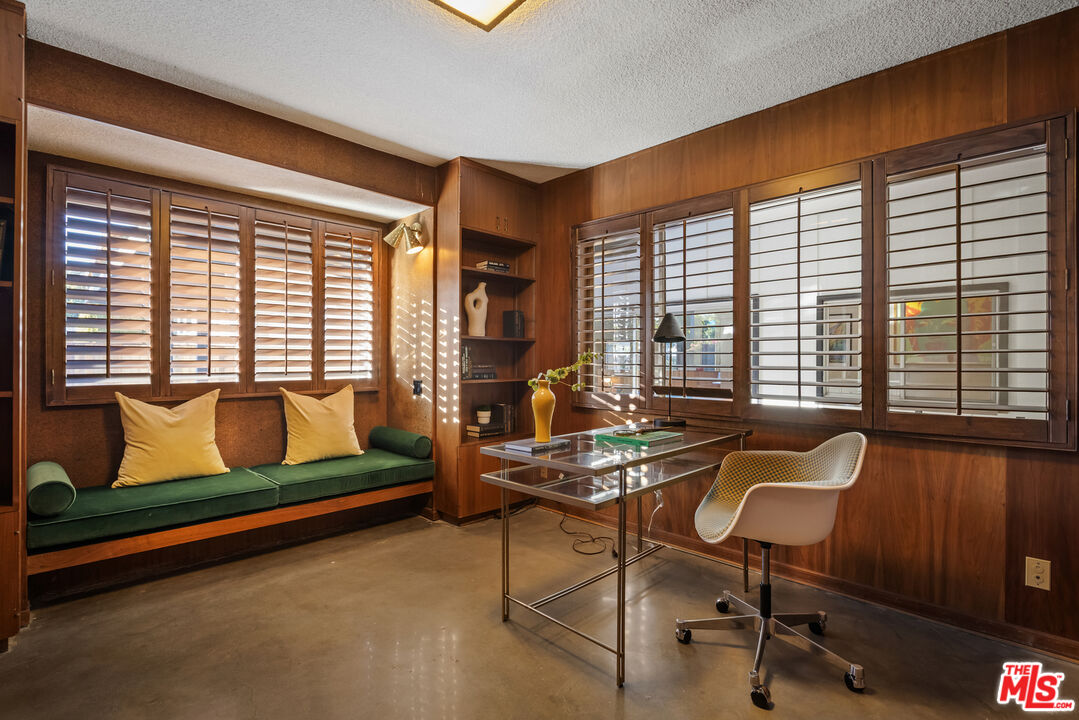 9440 Gallatin Road Downey, CA 90240 - Photo 37 of 55 a living room with furniture and a floor to ceiling window