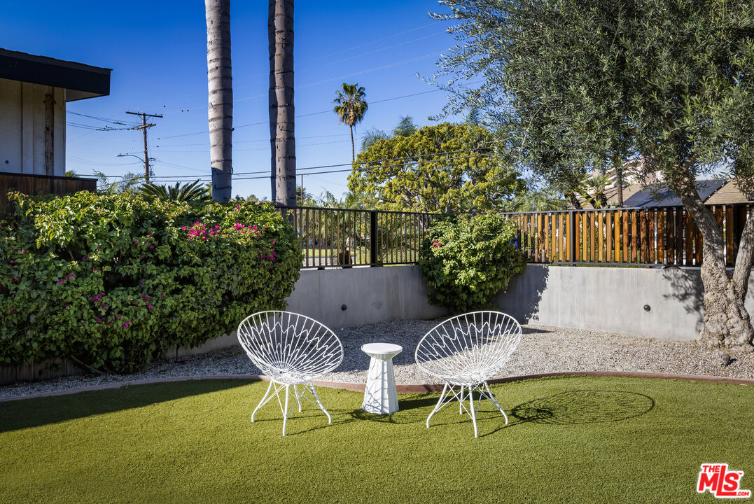 9440 Gallatin Road Downey, CA 90240 - Photo 54 of 55 a view of a chair and table in backyard