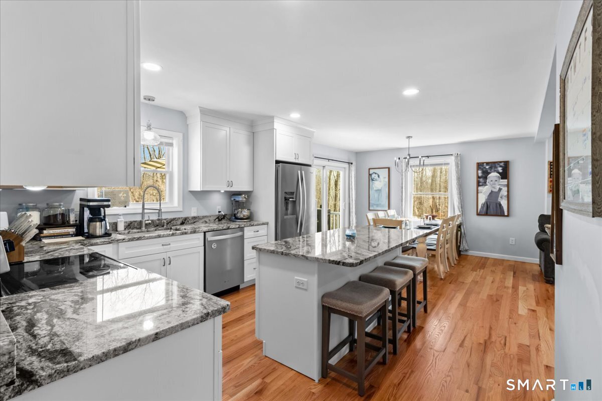 26 2nd Street Lebanon, CT 06249 - Photo 11 of 37 a large kitchen with granite countertop lots of counter top space and stainless steel appliances