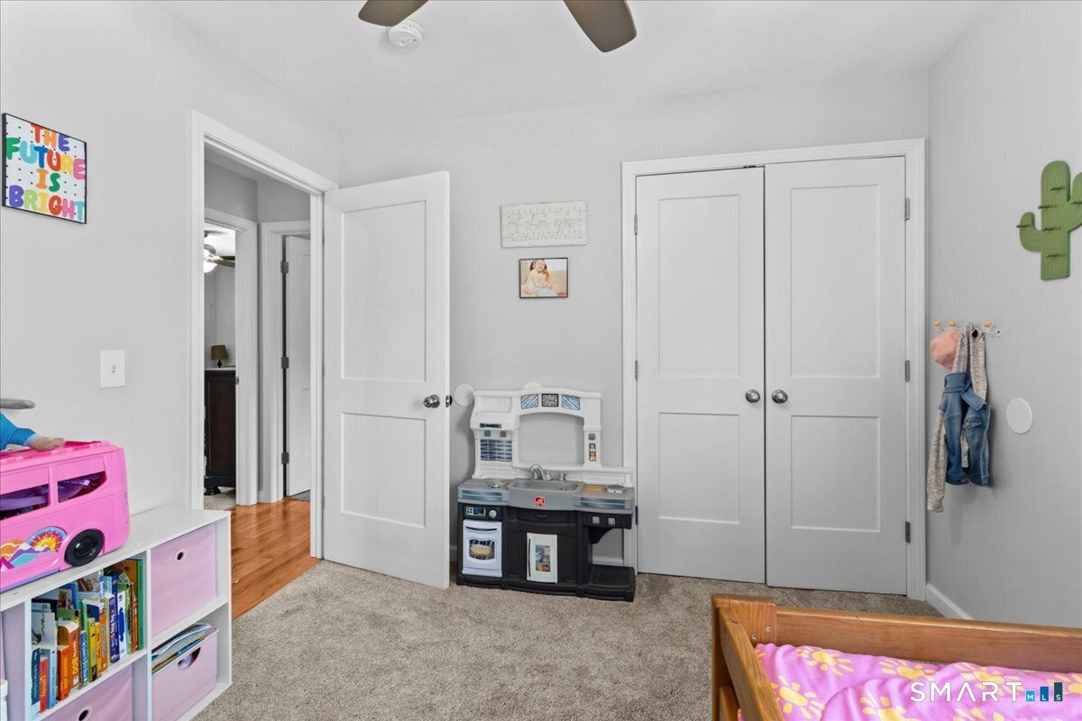 26 2nd Street Lebanon, CT 06249 - Photo 21 of 37 a spacious bedroom with a bed and a dresser in it
