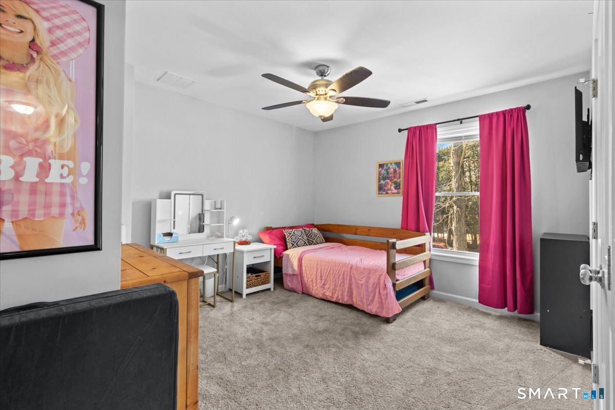 26 2nd Street Lebanon, CT 06249 - Photo 22 of 37 a bedroom with furniture and a large window