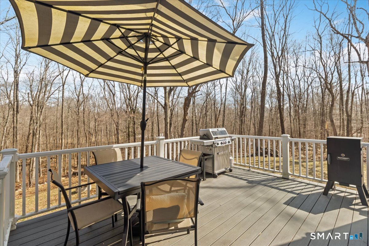 26 2nd Street Lebanon, CT 06249 - Photo 24 of 37 a view of a chairs and table on the deck