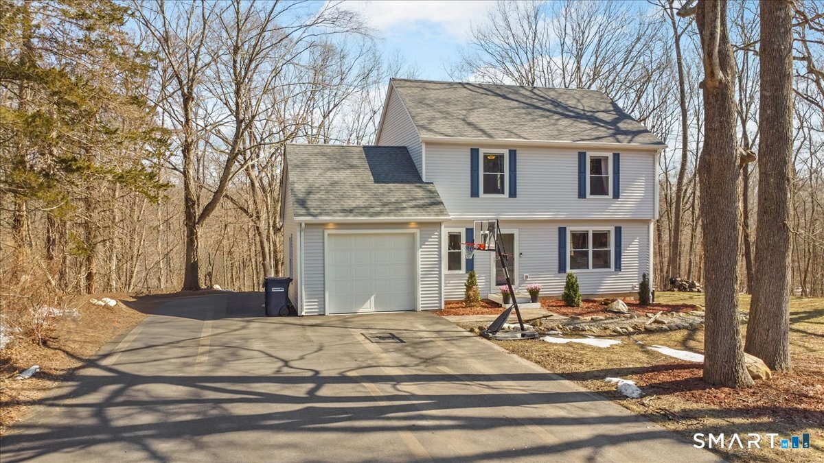 26 2nd Street Lebanon, CT 06249 - Photo 26 of 37 a front view of a house with a yard