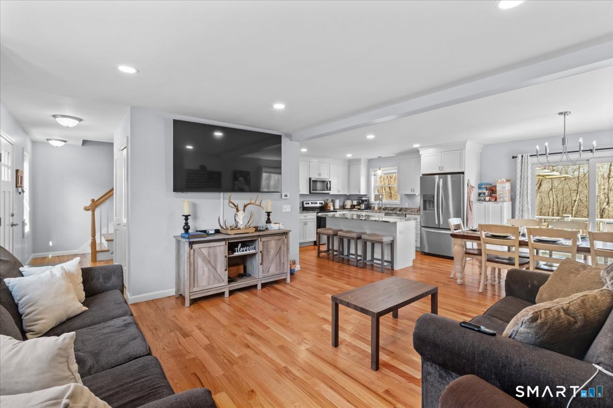 26 2nd Street Lebanon, CT 06249 - Photo 6 of 37 a living room with furniture and a flat screen tv
