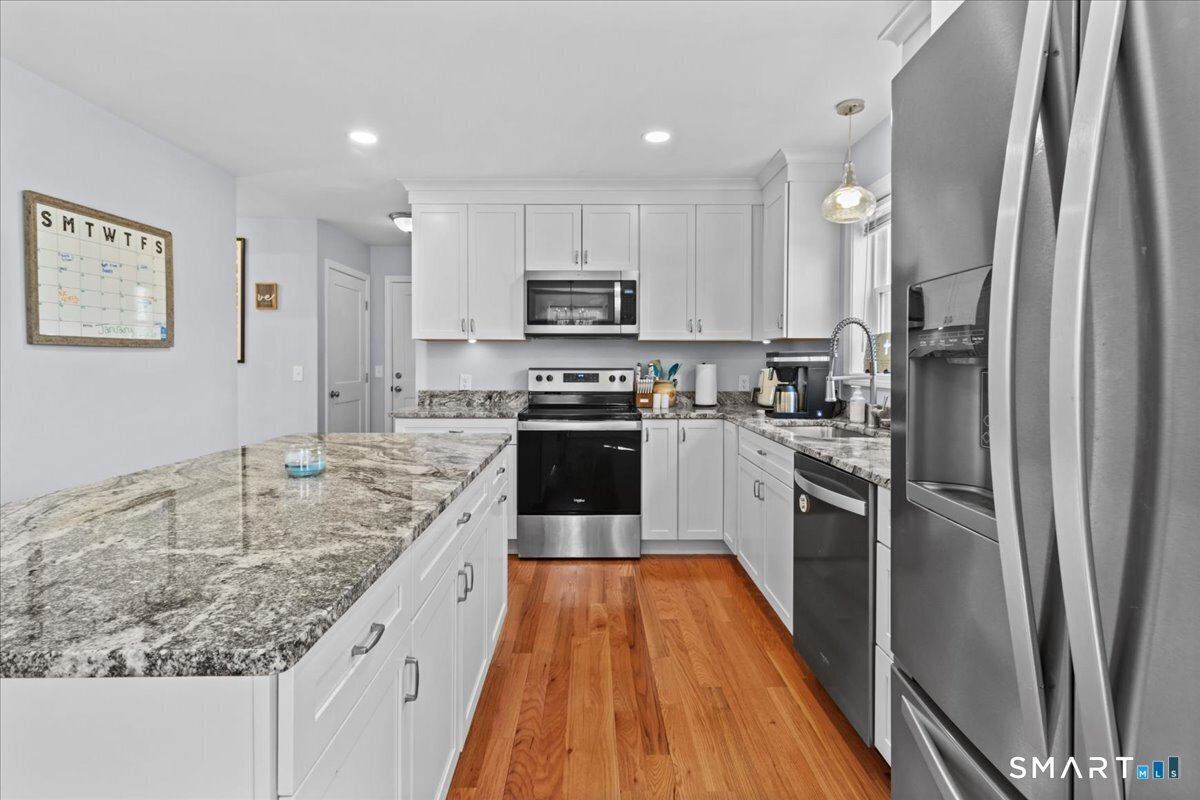 26 2nd Street Lebanon, CT 06249 - Photo 10 of 37 a kitchen with granite countertop a refrigerator stove and sink