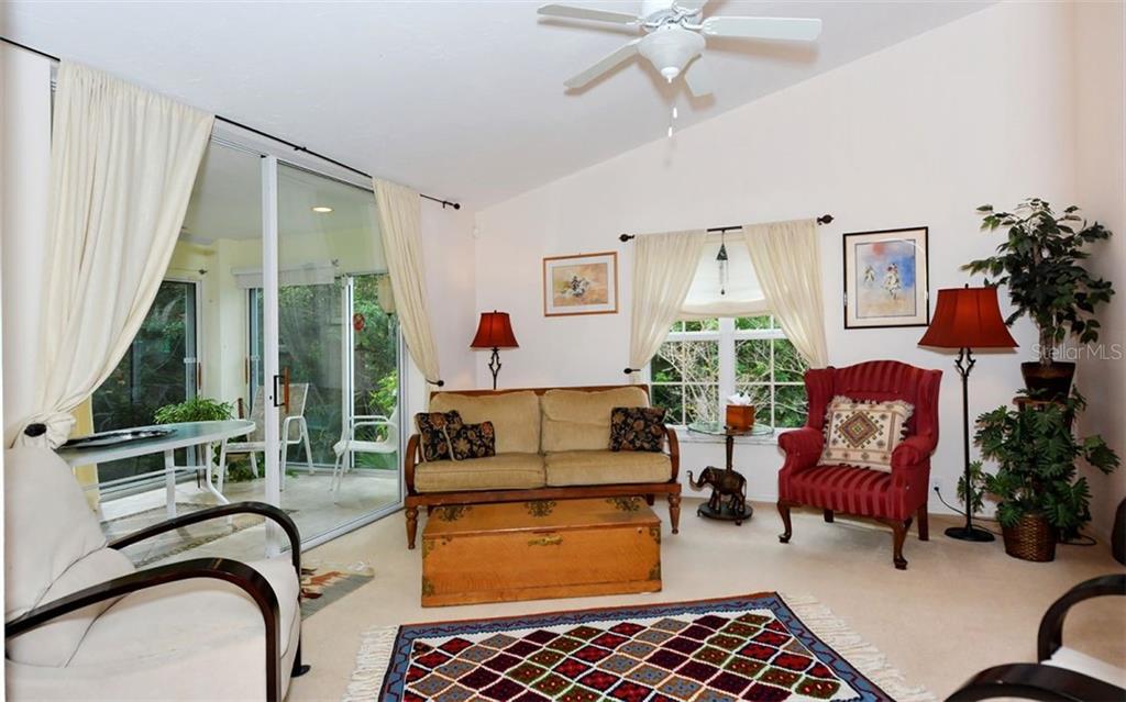 275 Woods Point Road Osprey, FL 34229 - Photo 7 of 40 Spacious library surrounded by light & greenery.