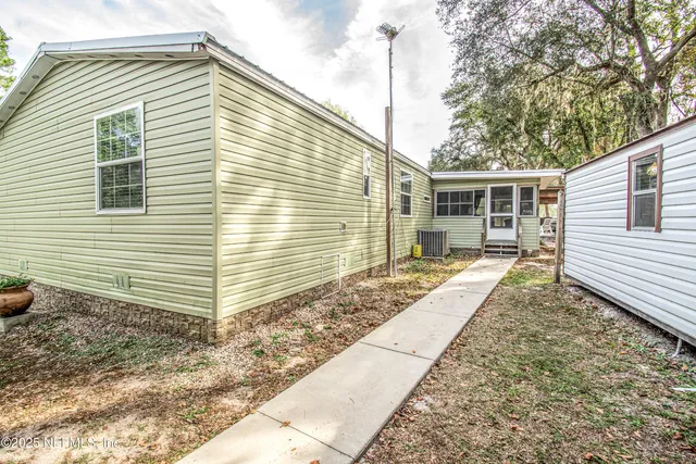 a house view with a backyard space