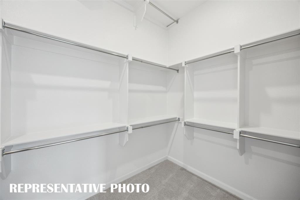 9530 Keep Street Frisco, TX 75035 - Photo 11 of 18 a view of a room with racks on the wall