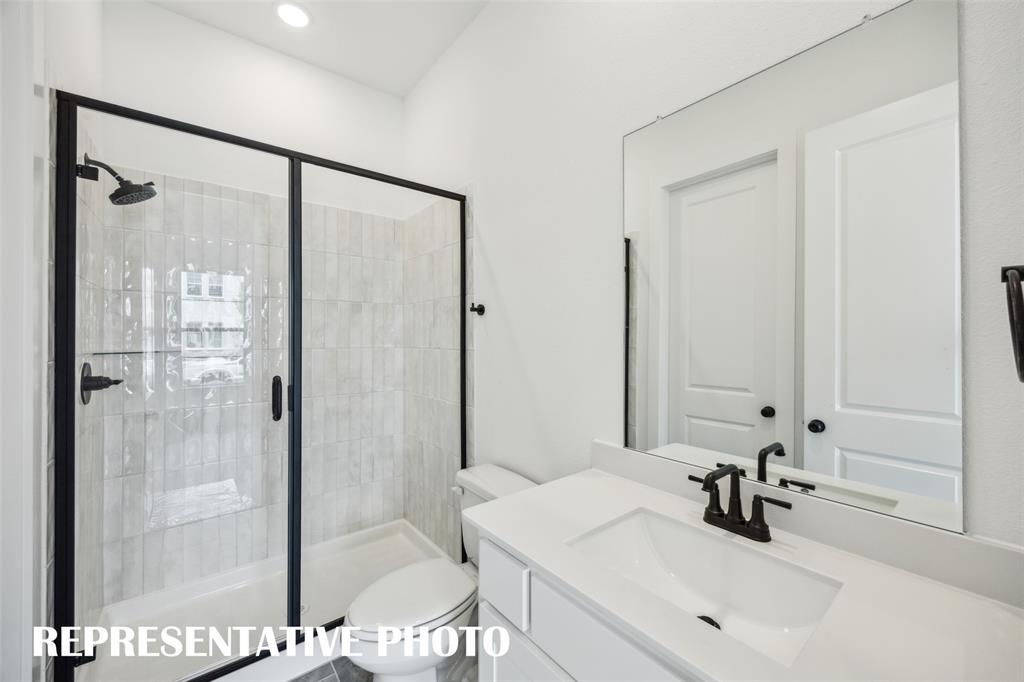 9530 Keep Street Frisco, TX 75035 - Photo 16 of 18 a bathroom with a sink and a mirror