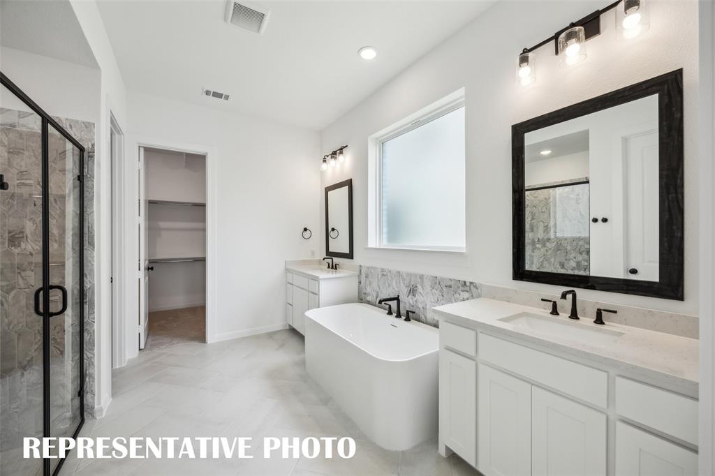 9530 Keep Street Frisco, TX 75035 - Photo 9 of 18 a bathroom with a double vanity sink mirror and