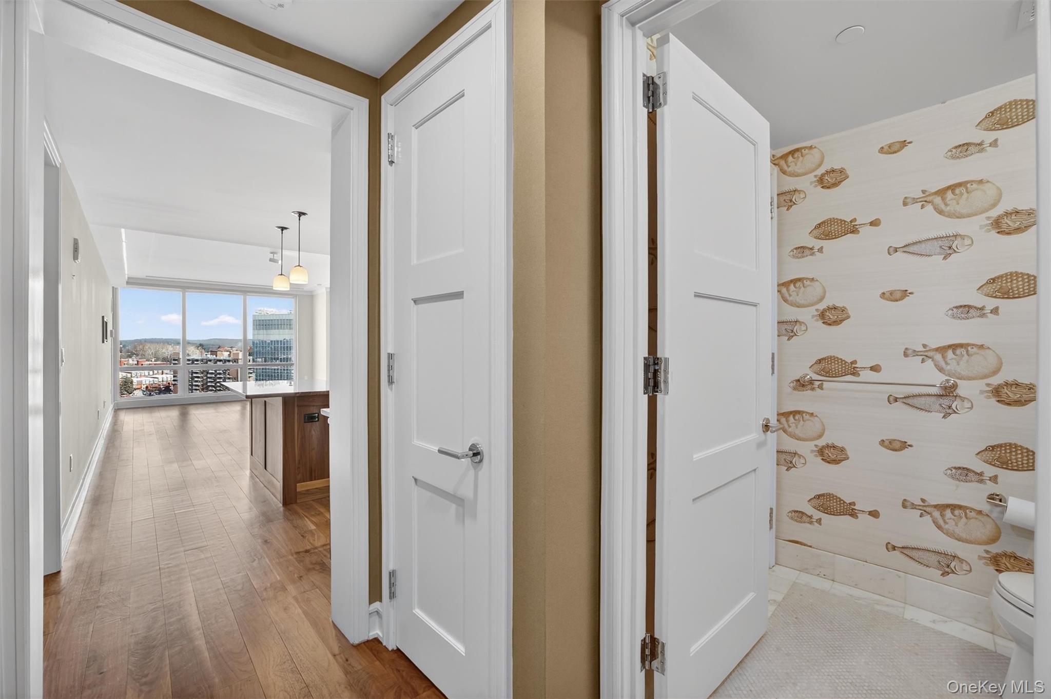 a view of a hallway view with wooden floor