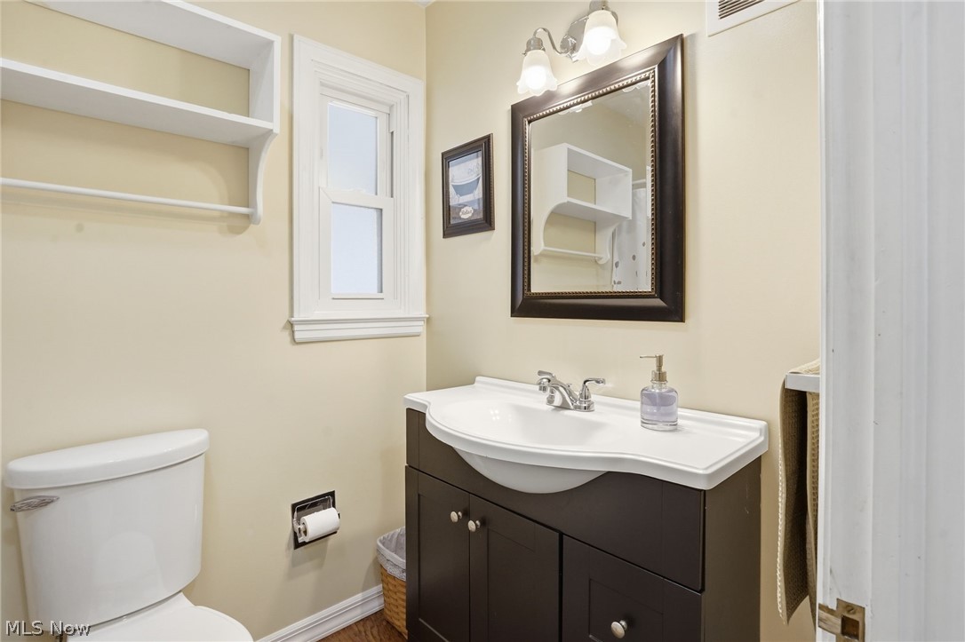 6655 Ceramic Road Crooksville, OH 43731 - Photo 20 of 34 Half bathroom with vanity and toilet