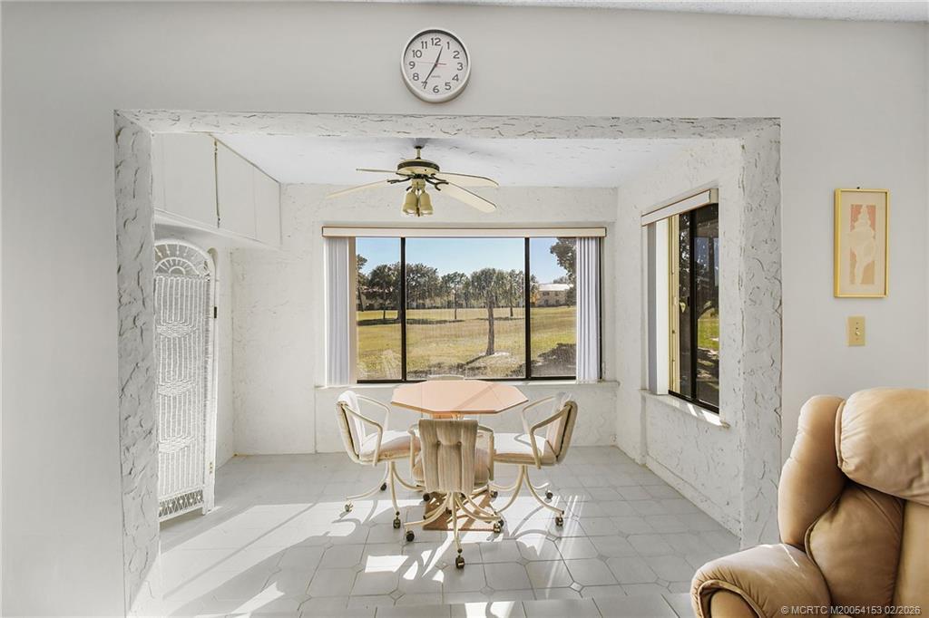 5413 Southeast Miles Grant Road, Unit G206 Stuart, FL 34997 - Photo 19 of 79 a living room with furniture and a window