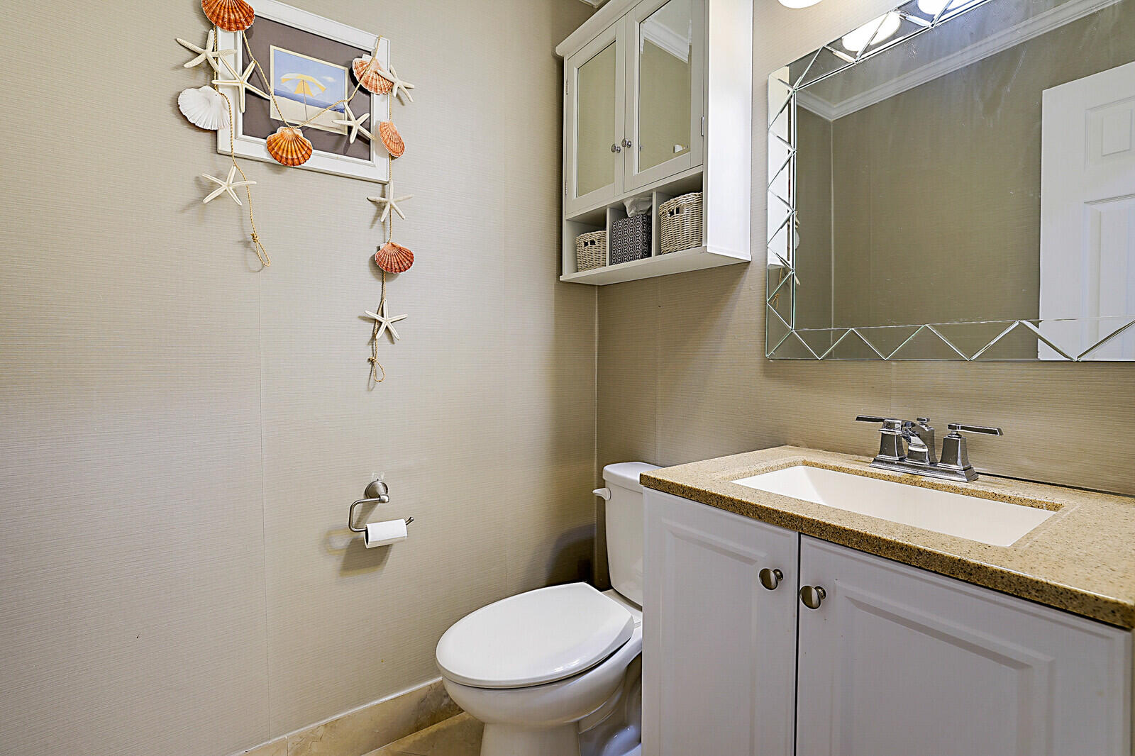 170 High Point Boulevard, Unit B Boynton Beach, FL 33435 - Photo 16 of 26 a bathroom with a granite countertop toilet sink and mirror