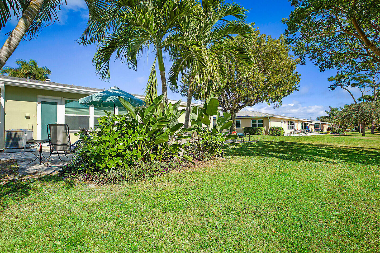 170 High Point Boulevard, Unit B Boynton Beach, FL 33435 - Photo 26 of 26 a front view of a house with a yard