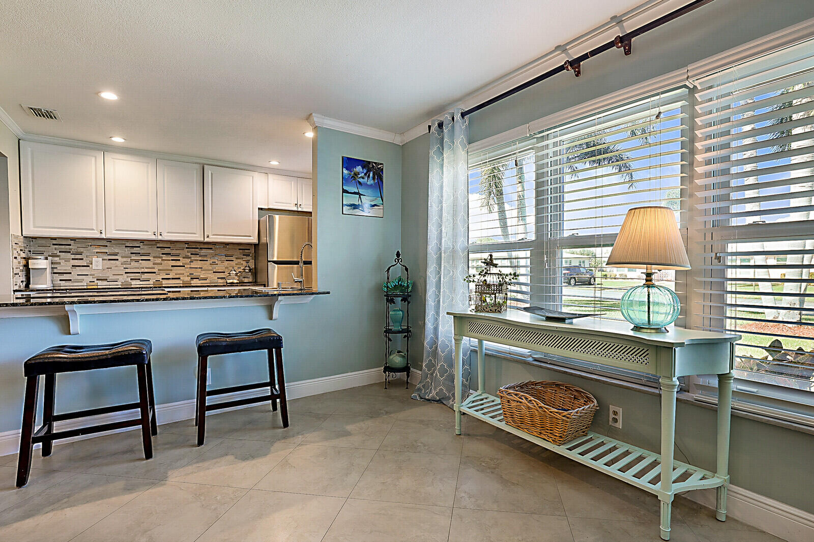 170 High Point Boulevard, Unit B Boynton Beach, FL 33435 - Photo 4 of 26 a view of workspace with kitchen island hardwood floor and a sink