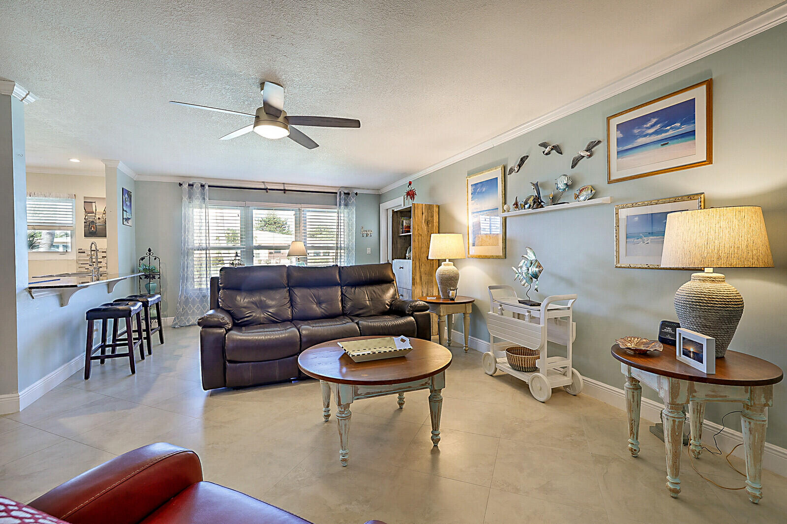 170 High Point Boulevard, Unit B Boynton Beach, FL 33435 - Photo 7 of 26 a living room with furniture and a large window