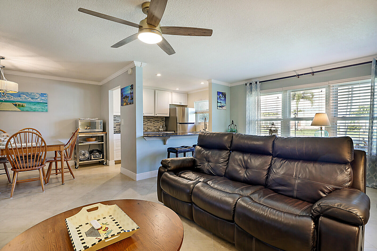 170 High Point Boulevard, Unit B Boynton Beach, FL 33435 - Photo 8 of 26 a living room with furniture ceiling fan and a window