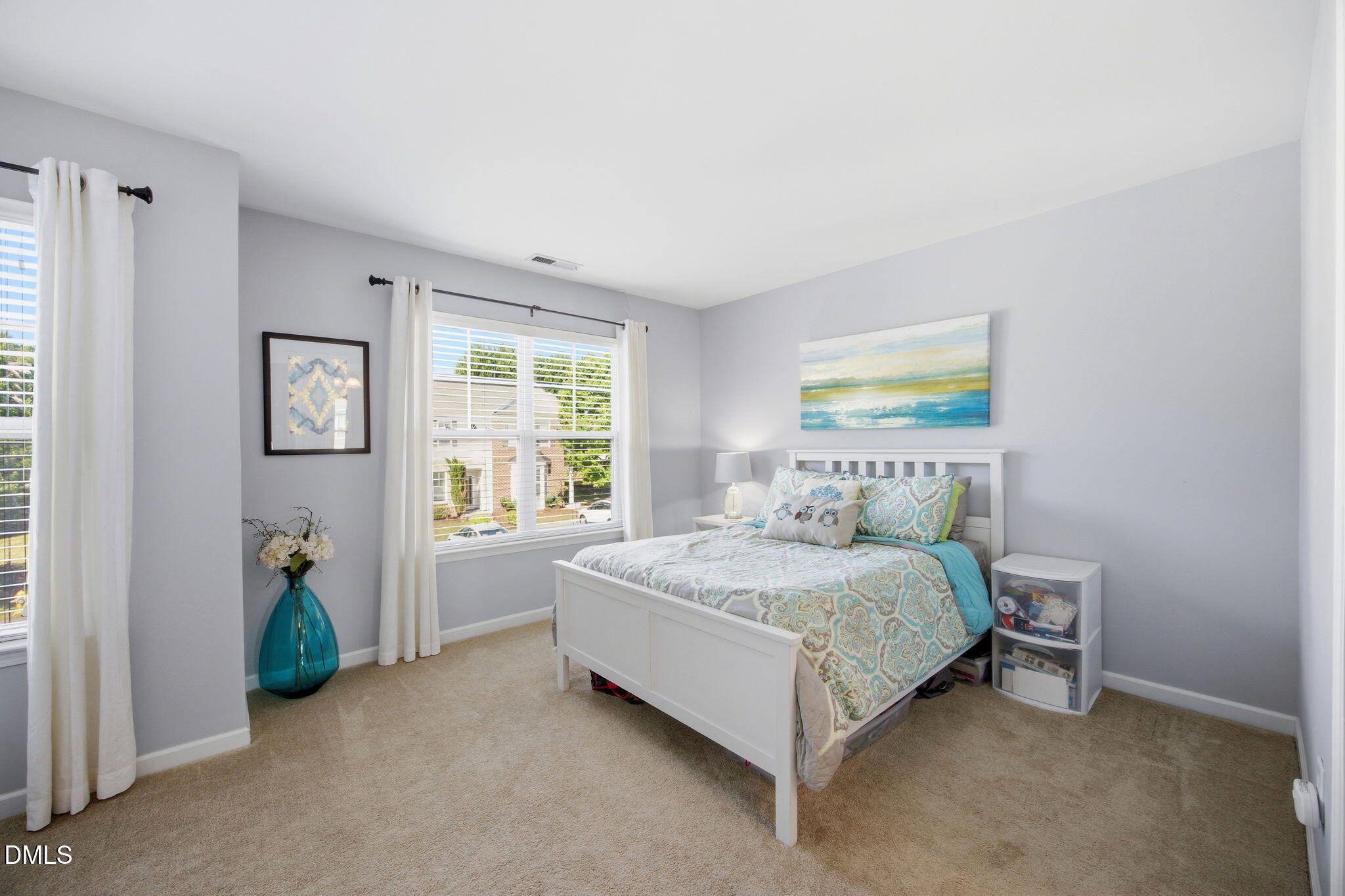 2827 Corbett Grove Drive Raleigh, NC 27616 - Photo 24 of 49 a bedroom with a bed and a table