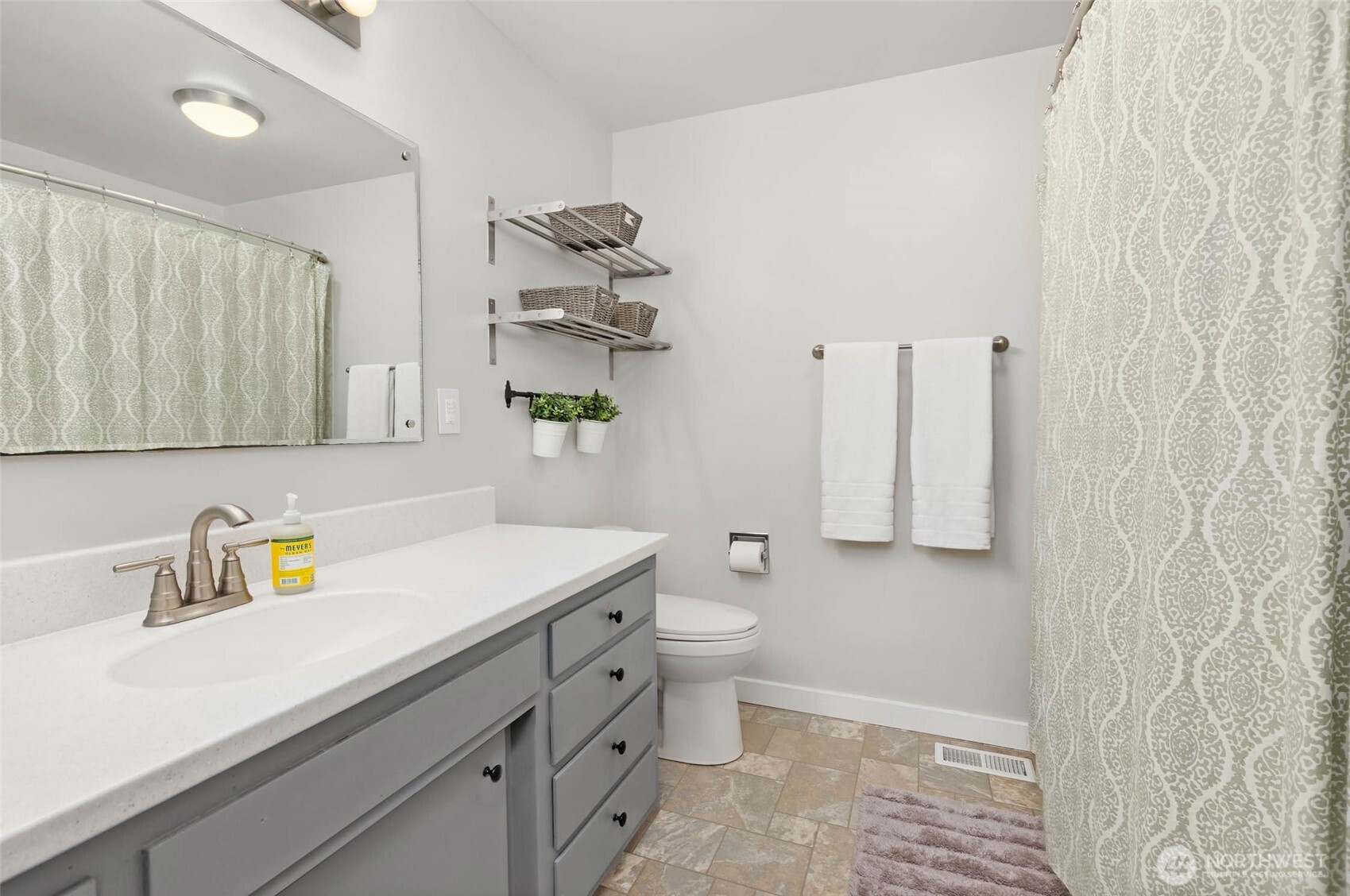 4726 South Victor Street Seattle, WA 98178 - Photo 18 of 30 a bathroom with a sink toilet and shower