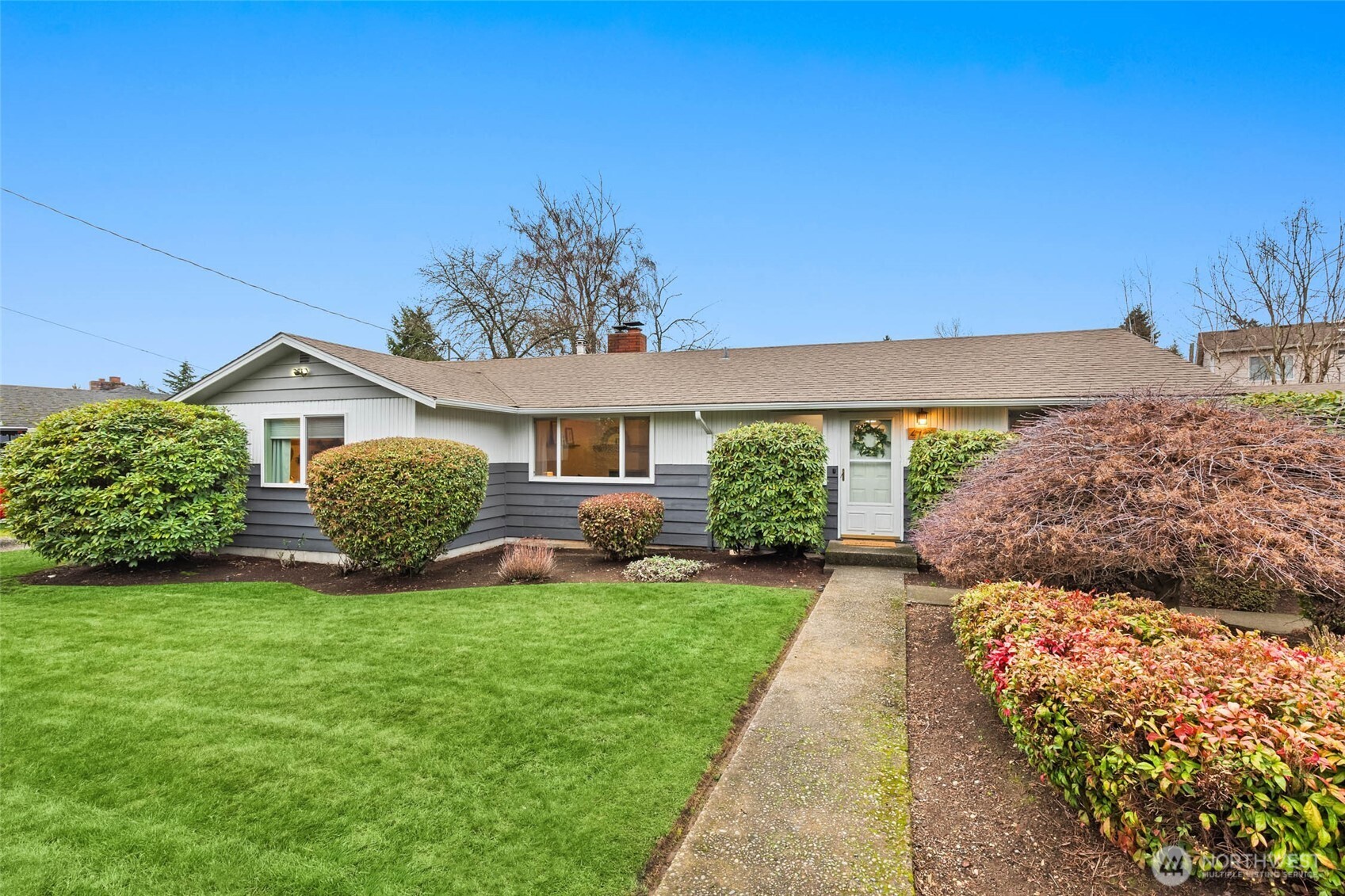 4726 South Victor Street Seattle, WA 98178 - Photo 29 of 30 a view of a house with a yard and pathway