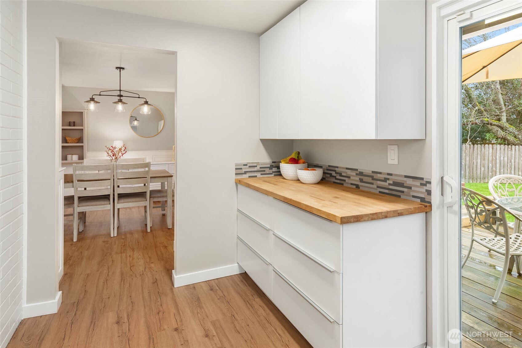 4726 South Victor Street Seattle, WA 98178 - Photo 10 of 30 a kitchen with kitchen island a stove a sink and a refrigerator