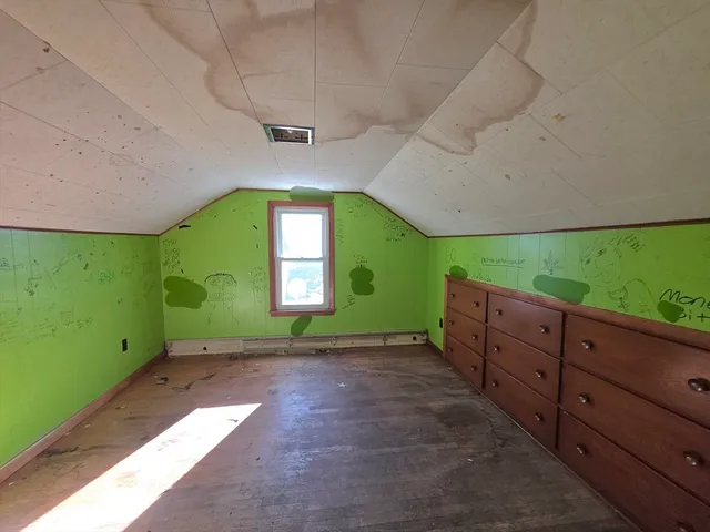 a view of a room with a large window