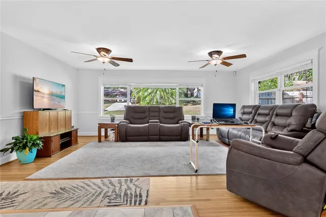 a living room with furniture and a flat screen tv