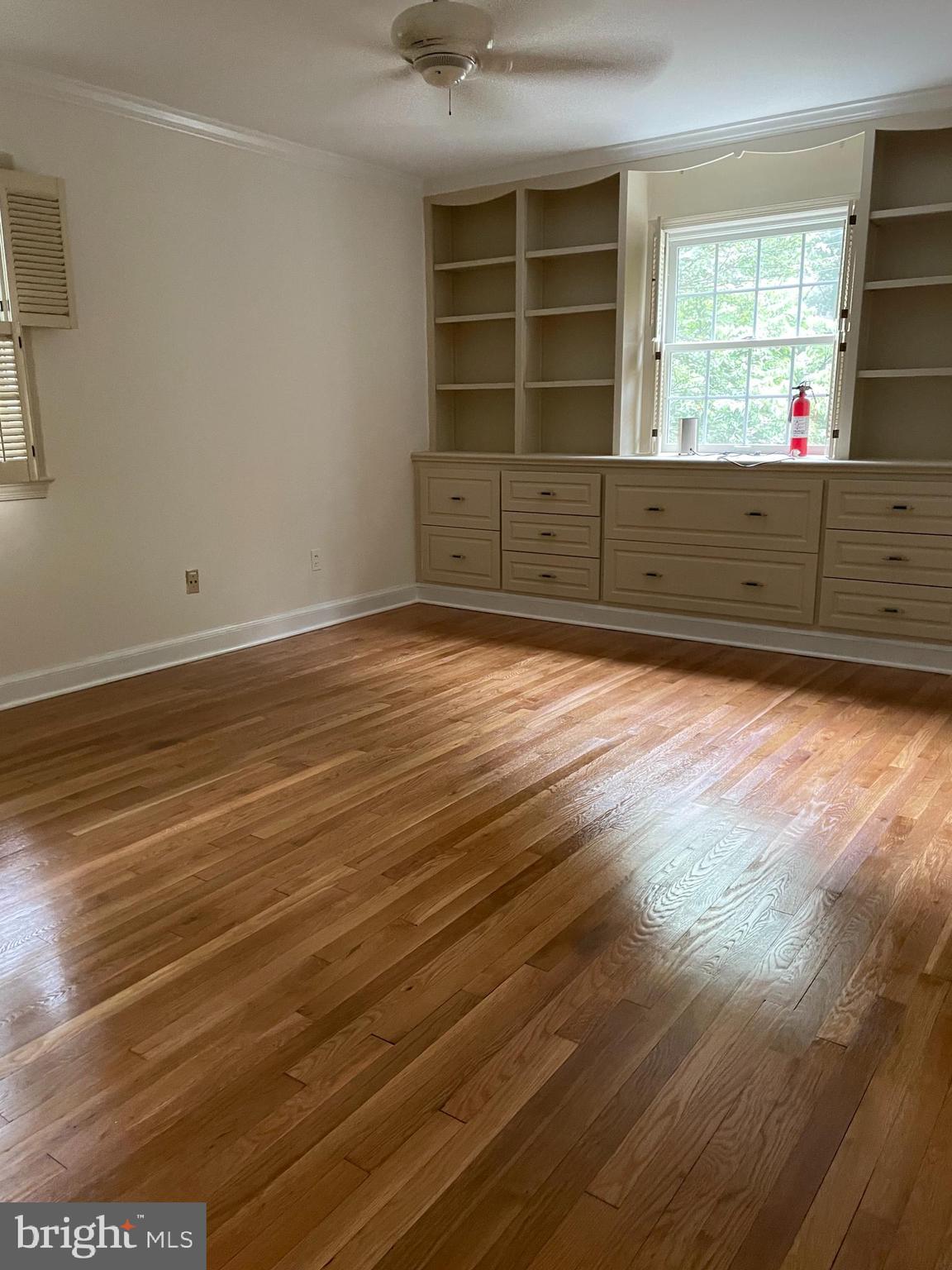 2266 48th Street Northwest Washington, DC 20007 - Photo 12 of 28 a view of a room with wooden floor and windows