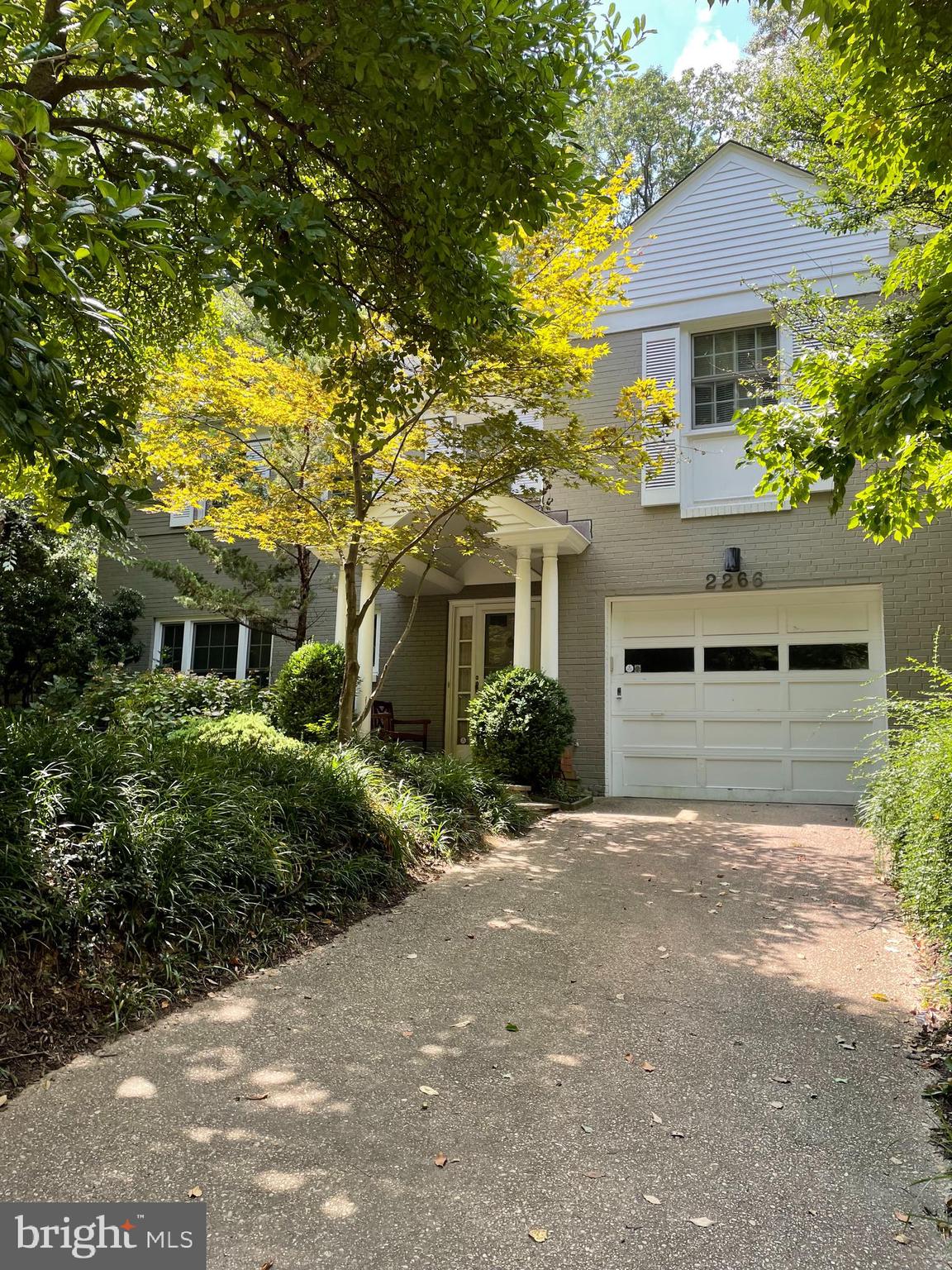 2266 48th Street Northwest Washington, DC 20007 - Photo 22 of 28 a front view of a house with a garden