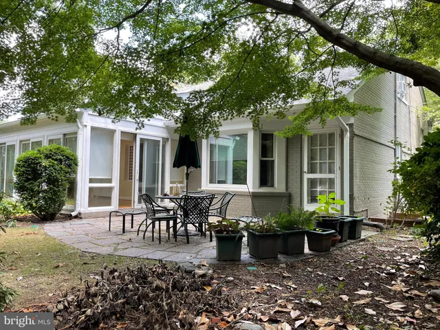 a front view of house with yard and outdoor seating