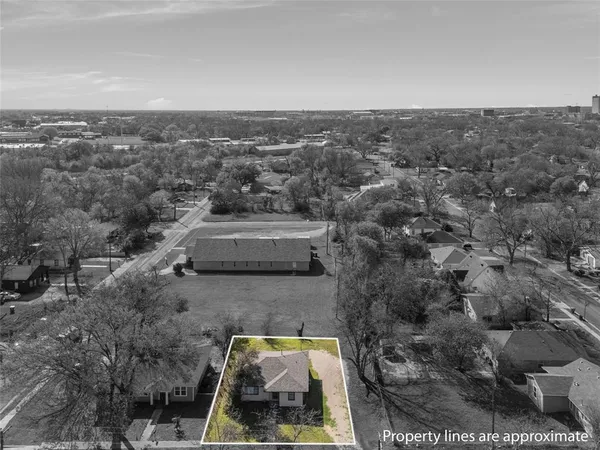 an aerial view of house with yard