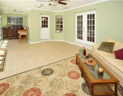 311 North Jungle Road Geneva, FL 32732 - Photo 8 of 12 Patio/Deck - Lots of space for entertaining with this sunroom open to pool and patio area.