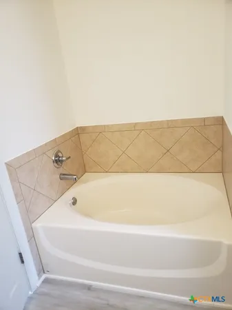 a bathroom with a bathtub