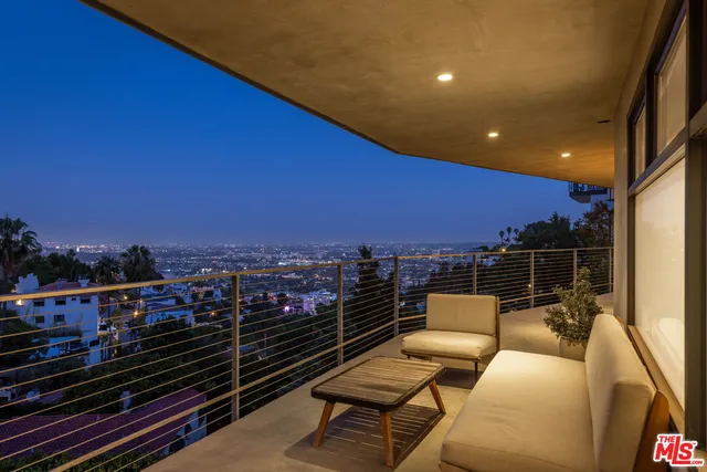 a view of a balcony with city view