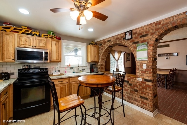 6688 Rich Road DeKalb, IL 60115 - Photo 3 of 27 a view of a kitchen and dining room