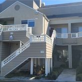 a front view of a house with large windows