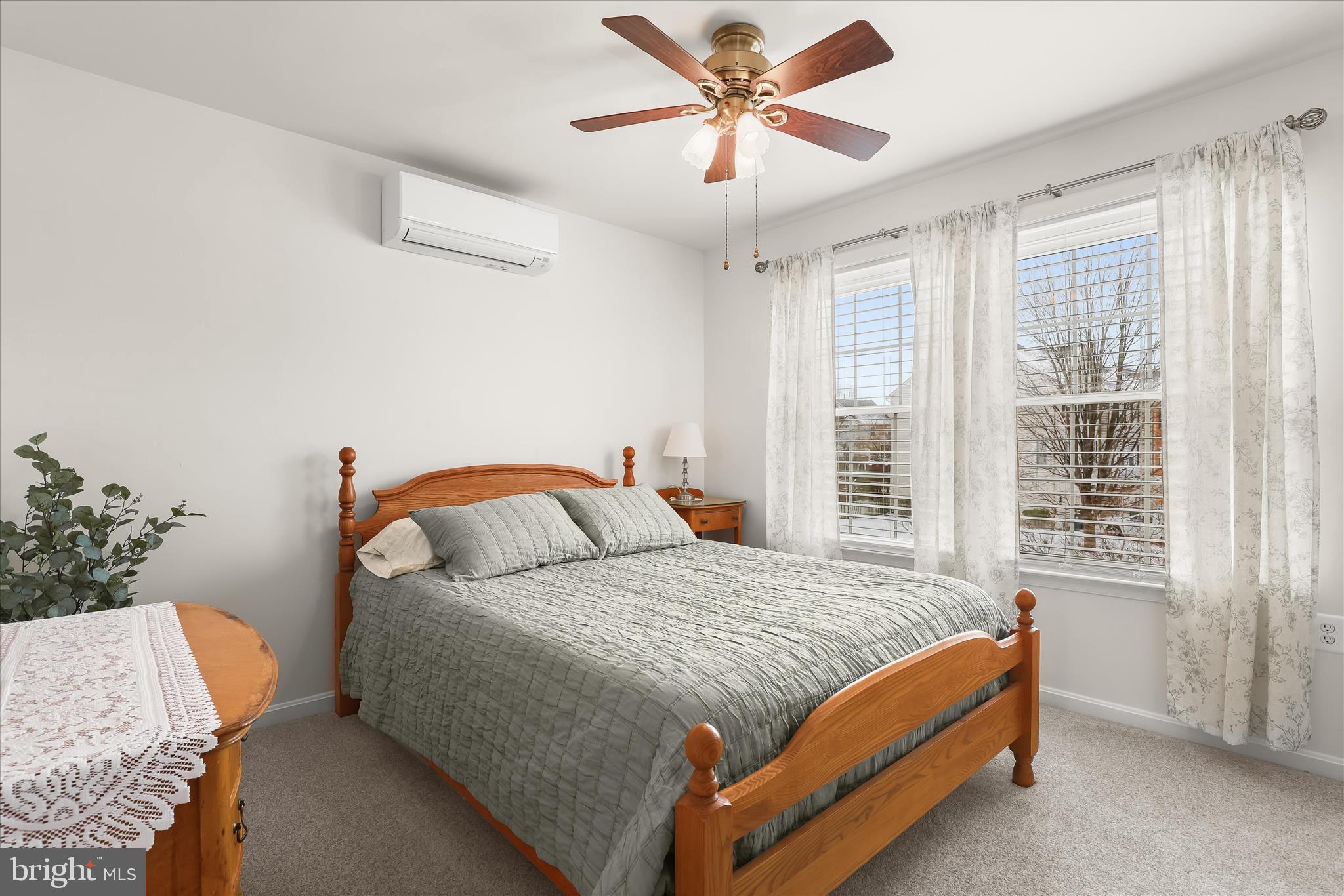 6463 Tydings Road Sykesville, MD 21784 - Photo 37 of 104 a bedroom with a bed and a chandelier